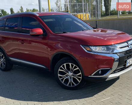 Красный Мицубиси Аутлендер, объемом двигателя 2.4 л и пробегом 113 тыс. км за 15900 $, фото 1 на Automoto.ua