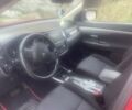 Красный Мицубиси Аутлендер, объемом двигателя 2.36 л и пробегом 115 тыс. км за 14200 $, фото 1 на Automoto.ua