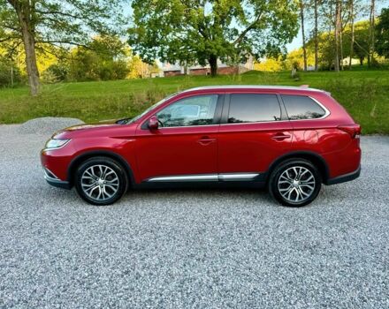 Красный Мицубиси Аутлендер, объемом двигателя 3 л и пробегом 60 тыс. км за 4900 $, фото 3 на Automoto.ua