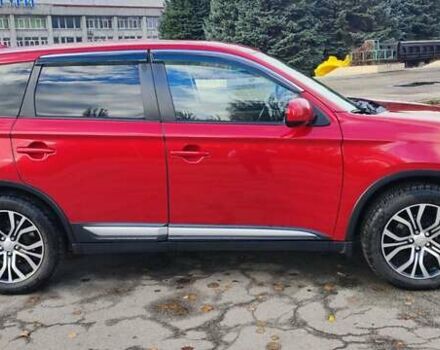 Красный Мицубиси Аутлендер, объемом двигателя 2.36 л и пробегом 80 тыс. км за 16500 $, фото 2 на Automoto.ua