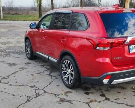 Красный Мицубиси Аутлендер, объемом двигателя 2.36 л и пробегом 80 тыс. км за 16500 $, фото 3 на Automoto.ua