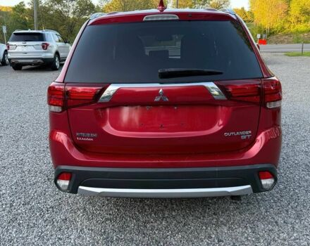 Красный Мицубиси Аутлендер, объемом двигателя 3 л и пробегом 60 тыс. км за 4900 $, фото 5 на Automoto.ua