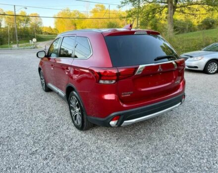 Красный Мицубиси Аутлендер, объемом двигателя 3 л и пробегом 57 тыс. км за 13200 $, фото 4 на Automoto.ua