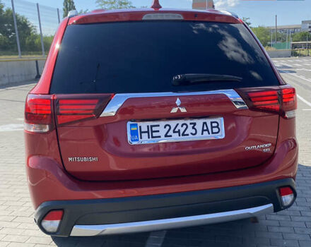 Красный Мицубиси Аутлендер, объемом двигателя 2.4 л и пробегом 113 тыс. км за 15900 $, фото 3 на Automoto.ua