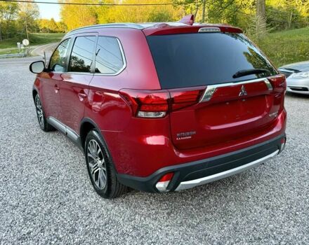 Красный Мицубиси Аутлендер, объемом двигателя 3 л и пробегом 60 тыс. км за 4900 $, фото 4 на Automoto.ua
