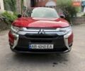 Червоний Міцубісі Аутлендер, об'ємом двигуна 2.4 л та пробігом 120 тис. км за 16000 $, фото 1 на Automoto.ua