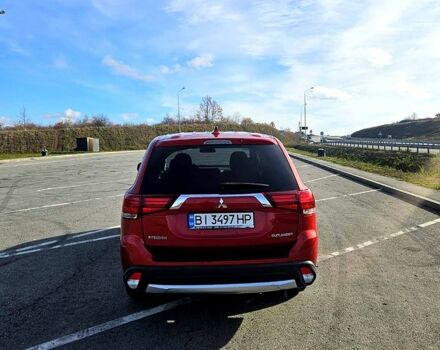 Красный Мицубиси Аутлендер, объемом двигателя 2.4 л и пробегом 174 тыс. км за 14300 $, фото 1 на Automoto.ua