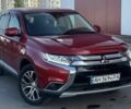 Красный Мицубиси Аутлендер, объемом двигателя 2.4 л и пробегом 75 тыс. км за 15600 $, фото 1 на Automoto.ua