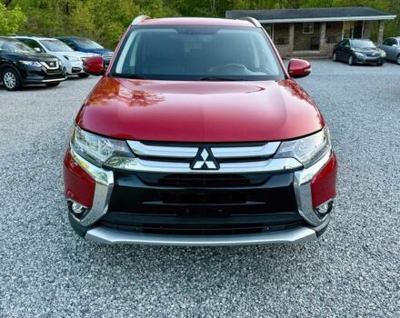 Красный Мицубиси Аутлендер, объемом двигателя 3 л и пробегом 60 тыс. км за 4900 $, фото 1 на Automoto.ua