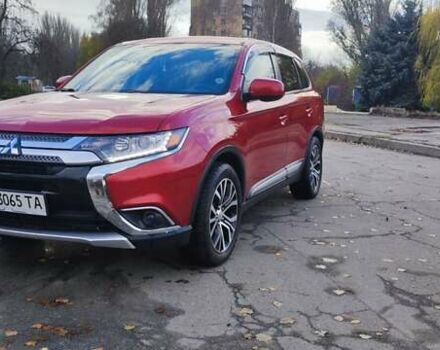 Красный Мицубиси Аутлендер, объемом двигателя 2.36 л и пробегом 80 тыс. км за 16500 $, фото 1 на Automoto.ua