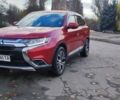 Красный Мицубиси Аутлендер, объемом двигателя 2.36 л и пробегом 80 тыс. км за 16500 $, фото 1 на Automoto.ua