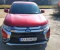 Красный Мицубиси Аутлендер, объемом двигателя 2.36 л и пробегом 100 тыс. км за 16500 $, фото 1 на Automoto.ua