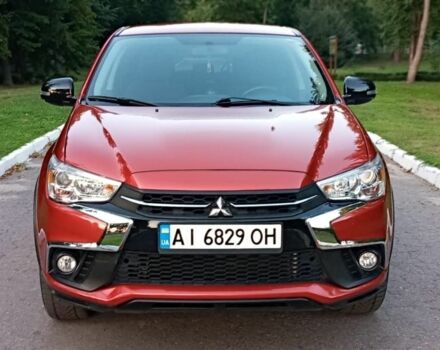 Красный Мицубиси Аутлендер, объемом двигателя 2 л и пробегом 80 тыс. км за 12400 $, фото 2 на Automoto.ua