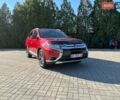 Красный Мицубиси Аутлендер, объемом двигателя 3 л и пробегом 124 тыс. км за 18000 $, фото 1 на Automoto.ua