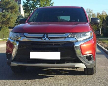 Красный Мицубиси Аутлендер, объемом двигателя 2.4 л и пробегом 117 тыс. км за 10500 $, фото 1 на Automoto.ua