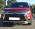 Красный Мицубиси Аутлендер, объемом двигателя 2.4 л и пробегом 117 тыс. км за 10500 $, фото 1 на Automoto.ua