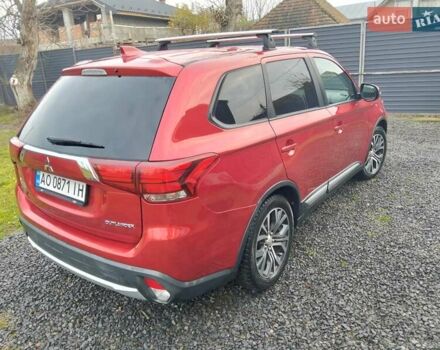 Красный Мицубиси Аутлендер, объемом двигателя 2.36 л и пробегом 110 тыс. км за 16800 $, фото 7 на Automoto.ua