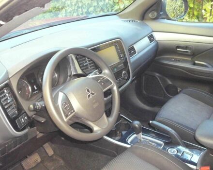 Красный Мицубиси Аутлендер, объемом двигателя 2.4 л и пробегом 117 тыс. км за 10500 $, фото 6 на Automoto.ua