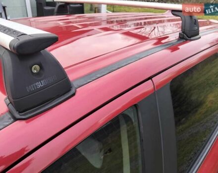 Красный Мицубиси Аутлендер, объемом двигателя 2.36 л и пробегом 110 тыс. км за 16800 $, фото 5 на Automoto.ua