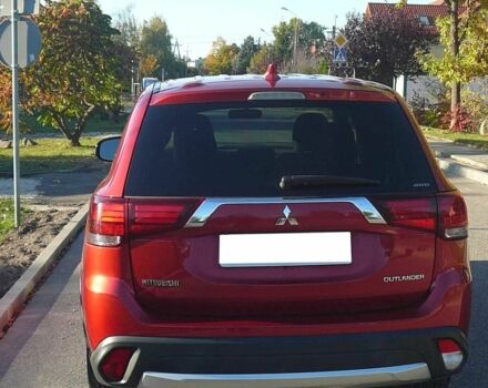 Красный Мицубиси Аутлендер, объемом двигателя 2.4 л и пробегом 117 тыс. км за 10500 $, фото 2 на Automoto.ua