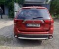 Красный Мицубиси Аутлендер, объемом двигателя 2.36 л и пробегом 82 тыс. км за 16000 $, фото 3 на Automoto.ua