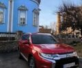 Красный Мицубиси Аутлендер, объемом двигателя 2.4 л и пробегом 125 тыс. км за 17400 $, фото 1 на Automoto.ua