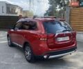 Красный Мицубиси Аутлендер, объемом двигателя 2.4 л и пробегом 75 тыс. км за 16550 $, фото 3 на Automoto.ua