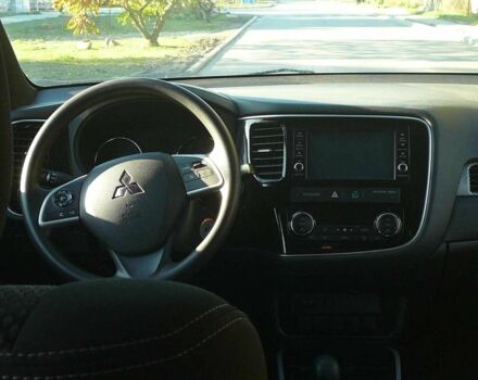 Красный Мицубиси Аутлендер, объемом двигателя 2.4 л и пробегом 117 тыс. км за 10500 $, фото 5 на Automoto.ua