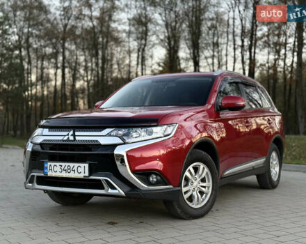 Красный Мицубиси Аутлендер, объемом двигателя 2 л и пробегом 85 тыс. км за 18900 $, фото 1 на Automoto.ua