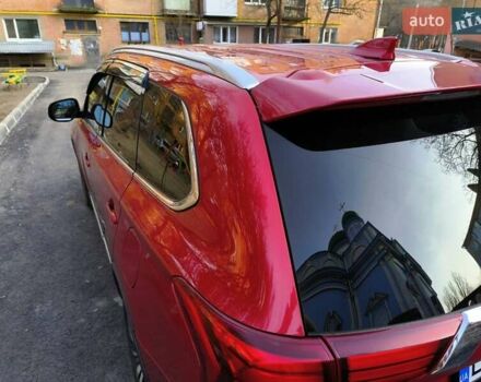 Красный Мицубиси Аутлендер, объемом двигателя 2.4 л и пробегом 125 тыс. км за 17400 $, фото 2 на Automoto.ua