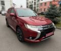 Красный Мицубиси Аутлендер, объемом двигателя 2 л и пробегом 176 тыс. км за 18900 $, фото 1 на Automoto.ua
