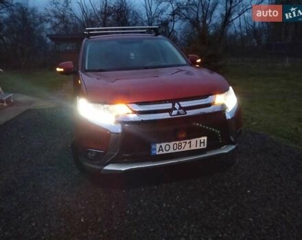 Красный Мицубиси Аутлендер, объемом двигателя 2.36 л и пробегом 110 тыс. км за 16800 $, фото 1 на Automoto.ua