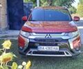 Красный Мицубиси Аутлендер, объемом двигателя 2.36 л и пробегом 85 тыс. км за 18700 $, фото 2 на Automoto.ua
