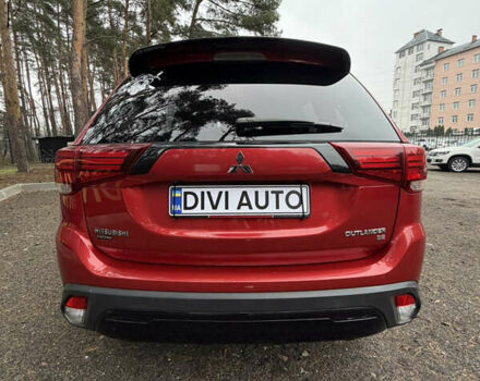Красный Мицубиси Аутлендер, объемом двигателя 2.4 л и пробегом 197 тыс. км за 18700 $, фото 3 на Automoto.ua