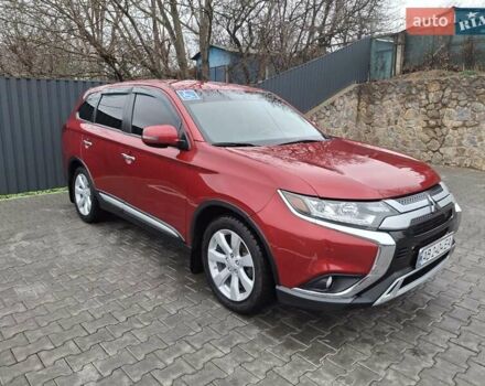 Красный Мицубиси Аутлендер, объемом двигателя 2.36 л и пробегом 110 тыс. км за 19000 $, фото 1 на Automoto.ua