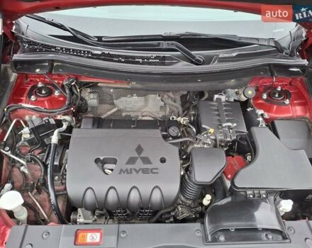 Красный Мицубиси Аутлендер, объемом двигателя 2.36 л и пробегом 110 тыс. км за 19000 $, фото 5 на Automoto.ua