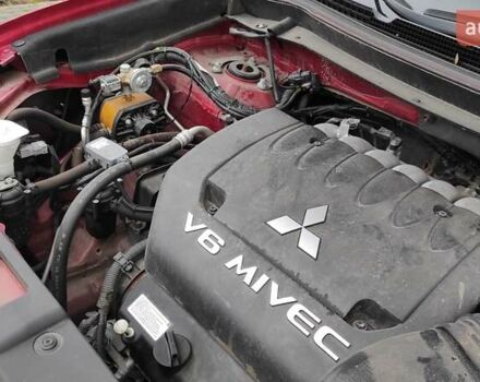 Червоний Міцубісі Аутлендер, об'ємом двигуна 3 л та пробігом 127 тис. км за 28500 $, фото 19 на Automoto.ua