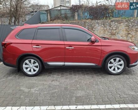 Красный Мицубиси Аутлендер, объемом двигателя 2.36 л и пробегом 110 тыс. км за 19000 $, фото 3 на Automoto.ua