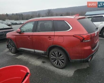 Красный Мицубиси Аутлендер, объемом двигателя 3 л и пробегом 100 тыс. км за 3000 $, фото 1 на Automoto.ua