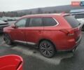 Красный Мицубиси Аутлендер, объемом двигателя 3 л и пробегом 100 тыс. км за 3000 $, фото 1 на Automoto.ua