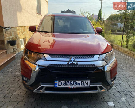 Красный Мицубиси Аутлендер, объемом двигателя 3 л и пробегом 106 тыс. км за 20700 $, фото 2 на Automoto.ua