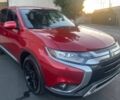 Красный Мицубиси Аутлендер, объемом двигателя 2.4 л и пробегом 58 тыс. км за 4600 $, фото 1 на Automoto.ua