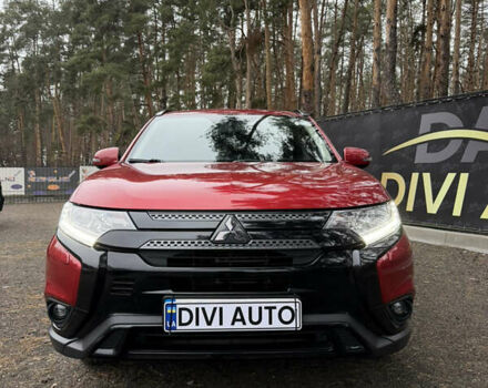 Красный Мицубиси Аутлендер, объемом двигателя 2.4 л и пробегом 197 тыс. км за 18700 $, фото 1 на Automoto.ua