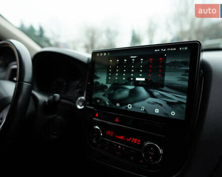 Красный Мицубиси Аутлендер, объемом двигателя 2.36 л и пробегом 145 тыс. км за 17000 $, фото 4 на Automoto.ua