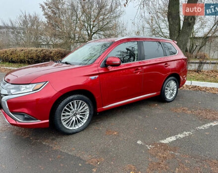 Красный Мицубиси Аутлендер, объемом двигателя 2.36 л и пробегом 65 тыс. км за 23800 $, фото 1 на Automoto.ua