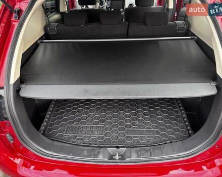 Красный Мицубиси Аутлендер, объемом двигателя 2 л и пробегом 38 тыс. км за 23000 $, фото 3 на Automoto.ua