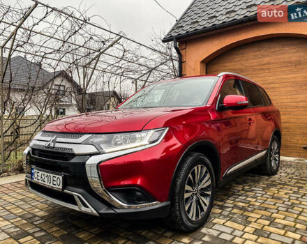 Красный Мицубиси Аутлендер, объемом двигателя 2 л и пробегом 40 тыс. км за 23500 $, фото 2 на Automoto.ua