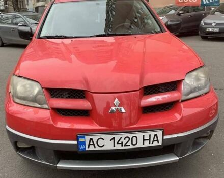 Красный Мицубиси Аутлендер, объемом двигателя 2 л и пробегом 340 тыс. км за 4300 $, фото 1 на Automoto.ua