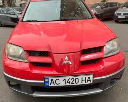 Красный Мицубиси Аутлендер, объемом двигателя 2 л и пробегом 344 тыс. км за 4300 $, фото 1 на Automoto.ua