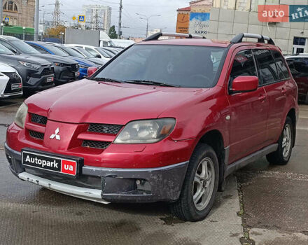 Красный Мицубиси Аутлендер, объемом двигателя 2.4 л и пробегом 226 тыс. км за 5490 $, фото 1 на Automoto.ua